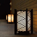 Black Wooden Side Table Lamp with Golden Glow